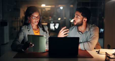 Tech, discussion and business people in office at night with creative project in collaboration. Feedback, laptop and manager with magazine editors for advice, publishing deadline or article on tablet