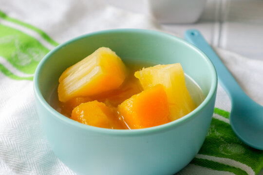 Indonesian Sweet Dessert Kolak with Cassava and Sweet Potato in Coconut Milk. his warm and comforting sweet soup is popular during Ramadan and enjoyed as a traditional snack across Indonesia and South