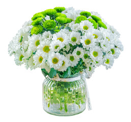 Glass flower vase holding white daisies. Small clear glass vase holding a cluster of delicate white daisies
