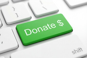 Green donate button on a white keyboard representing online donations, digital charity, crowdfunding, and nonprofit fundraising for finance campaigns and social support.