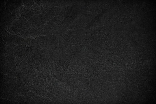 Dark grey black slate background or texture.
