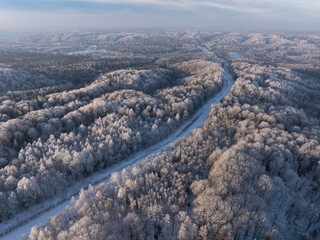 A path through a frost-covered forest. Aerial photo
