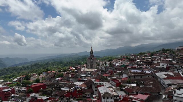 Picturesque latin village on top of a hill. Aerial dolly in