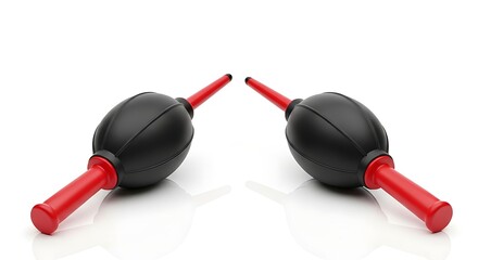 Two black air blowers with red handles isolated on white background for cleaning cameras lenses and keyboards
