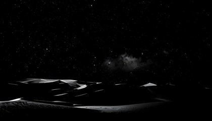 Starry night sky over rolling sand dunes, captured in monochrome, emphasizing contrast and atmospheric depth