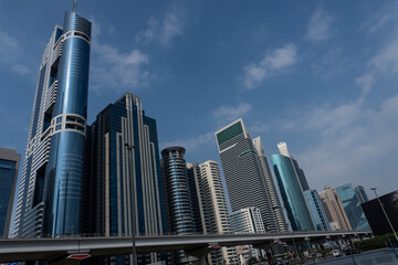 Naklejka premium Modern city skyline with high-rise office buildings and blue sky