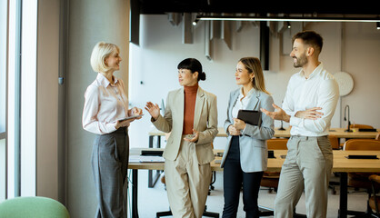 Business team discussing projects in a modern office environment