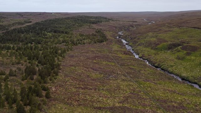 Drone shot of the Gress river amidst a glen on the Hebridean moorland.