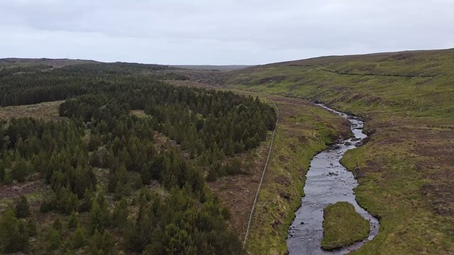 Drone shot of the Gress river in the village of Back as it flows inland.