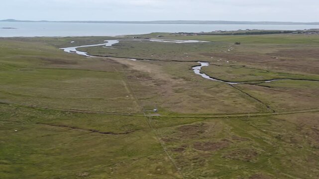 Drone shot of the villages of Gress and Back, with the Gress river and beach.
