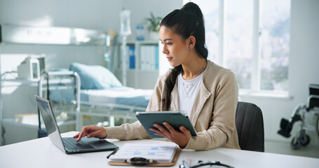Receptionist, laptop and tablet with woman in hospital for medical files, doctor letter and...