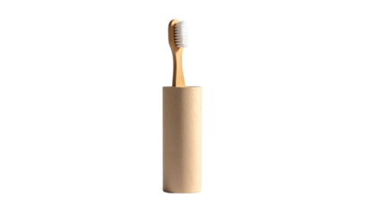 A bamboo toothbrush standing upright in a matching cylindrical holder against black