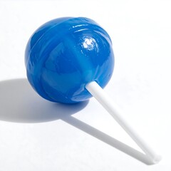 Round, blue, swirled lollipop on a white stick, casting a soft shadow, centered on a plain, bright surface