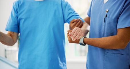 Hands, physiotherapist and patient with support for walking, help and guide with balance at...