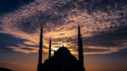 Silhouette of a Mosque against a Dramatic Sunset Sky.
