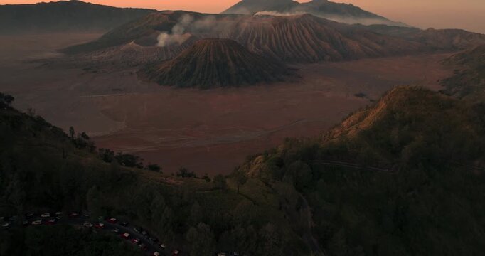 Aerial view 4k by drone of Bromo Mountain from King Kong Hill, Indonesia. Aerial view of Mount Bromo volcano on sunrise. Bromo Mount on Twilight at Kabupaten Probolinggo, Jawa Timur, Indonesia.