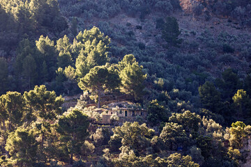 Stone house on a mountain slope with terraced cultivation © Lars Johansson