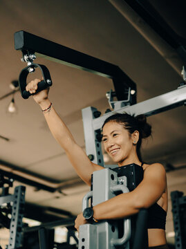 Athlete woman doing fitness training at the gym.  Workout and indoor sport.
