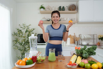 Smiling woman holding fresh fruit promoting healthy eating