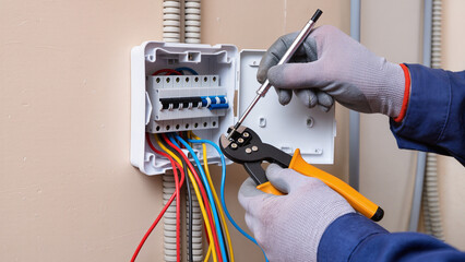 electrician repairing electrical outlet