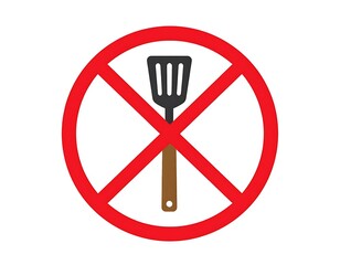 A red prohibition sign with a spatula inside, over a white background, communicates "no cooking