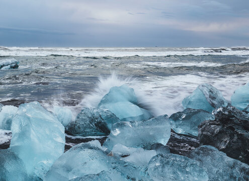 Blue ice chunks eroded by waves on Diamond Beach, Iceland