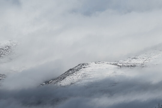 Snow-covered mountains and cloudy sky in the Pyrenees