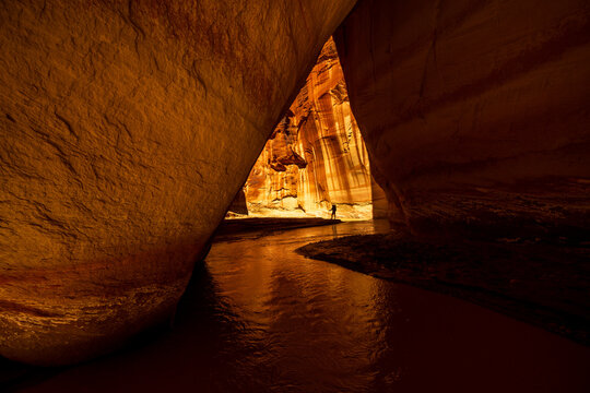 Hiker Exploring the narrows of Paria Canyon