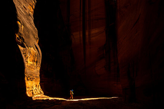 Solo adventurer navigating Utah canyon