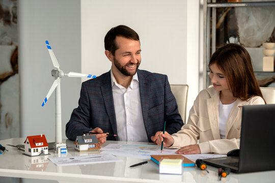 teenage student is discussing a project on wind turbines.