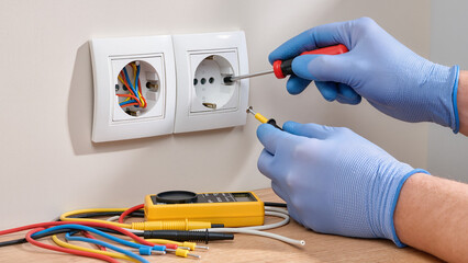 electrician with multimeter