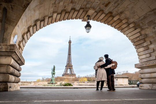 Couple embracing viewing iconic monument in paris