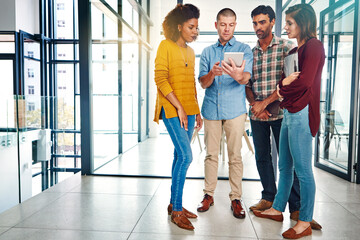 Tablet, meeting and business people in office with collaboration for creative project together. Team, digital technology and magazine editors with research for article with publishing in workplace.