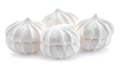 Four fluffy, pure white, meringue-like treats, with swirled tops, stand out against a white backdrop