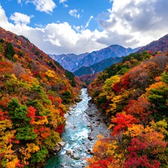 Scenic river flows through a valley, flanked by mountains and colorful autumn trees under cloudy skies