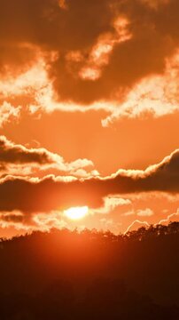 Beautiful sunrise time-lapse over the mountains with soft morning light and moving clouds.