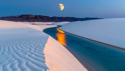 Poster Reflectie Moon over white sand dunes, reflected in stream, mountains backdrop, blue sky  © Sri