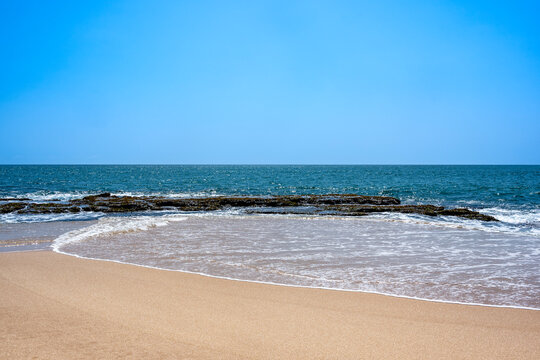 Sandy beach and waves at Marakolliya Beach Tangalle Sri Lanka coast