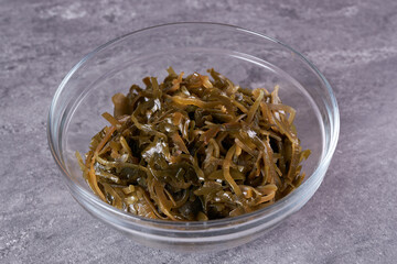 Seaweed in a bowl on the table.