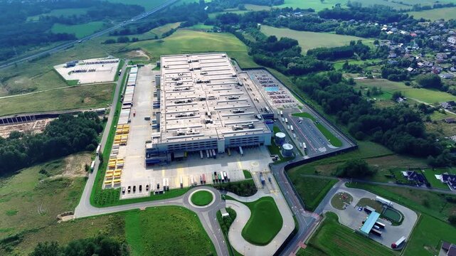 Aerial view of logistics center near local roads and farmland in Germany