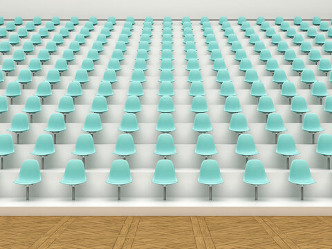 Empty modern lecture hall with rows of turquoise seats indoors