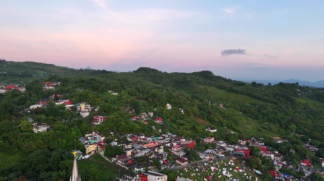 Cuetzalan Mexican village in middle of the jungle at sunset. Aerial