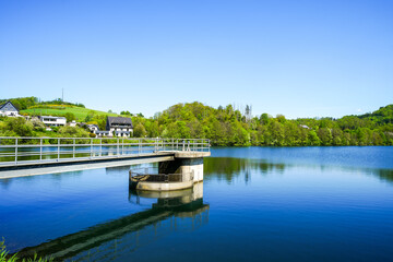 Fototapeta premium View of the Agger reservoir and the surrounding landscape. Nature by the lake near Gummersbach. 