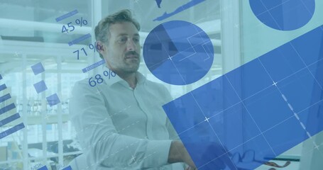 Animation of financial data processing over caucasian businessman in office - Powered by Adobe