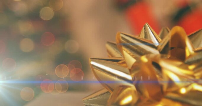 Animation of presents and snow falling over close up of over african american couple holding unk