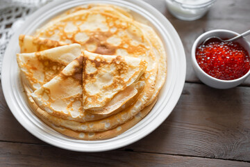 Thin crepes with red caviar