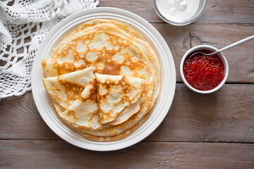 Thin crepes with red caviar