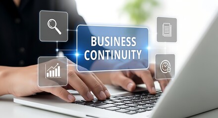Person typing on a laptop with a holographic interface displaying 'BUSINESS CONTINUITY' and icons for search, document, and timer, illustrating resilience and planning.