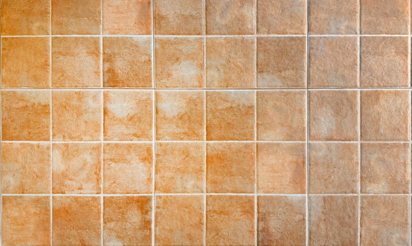 Rustic Terracotta Ceramic Wall Tiles Texture Background with Earthy Orange and Brown Tones, Traditional Mediterranean Patterned Square Tiles for Interior Design, Architecture and Home Decor.