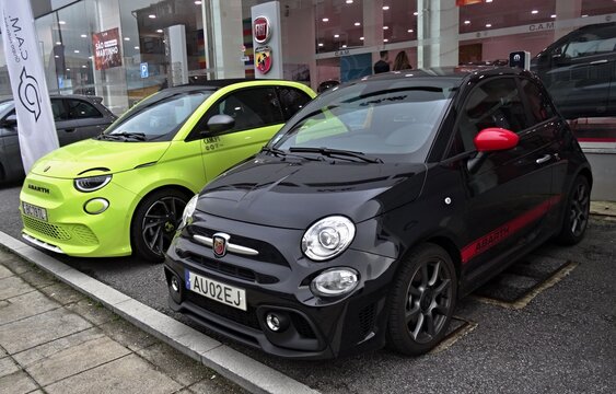Abarth 595 and electric 500e cars parked at Fiat dealership